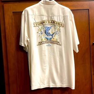 100% silk Tommy Bahama embroidered shirt . Very very cool! Great condition.